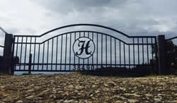 Double arch classic gate from Brenham Iron Works.