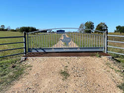 Double arch gate from Brenham Iron Works.